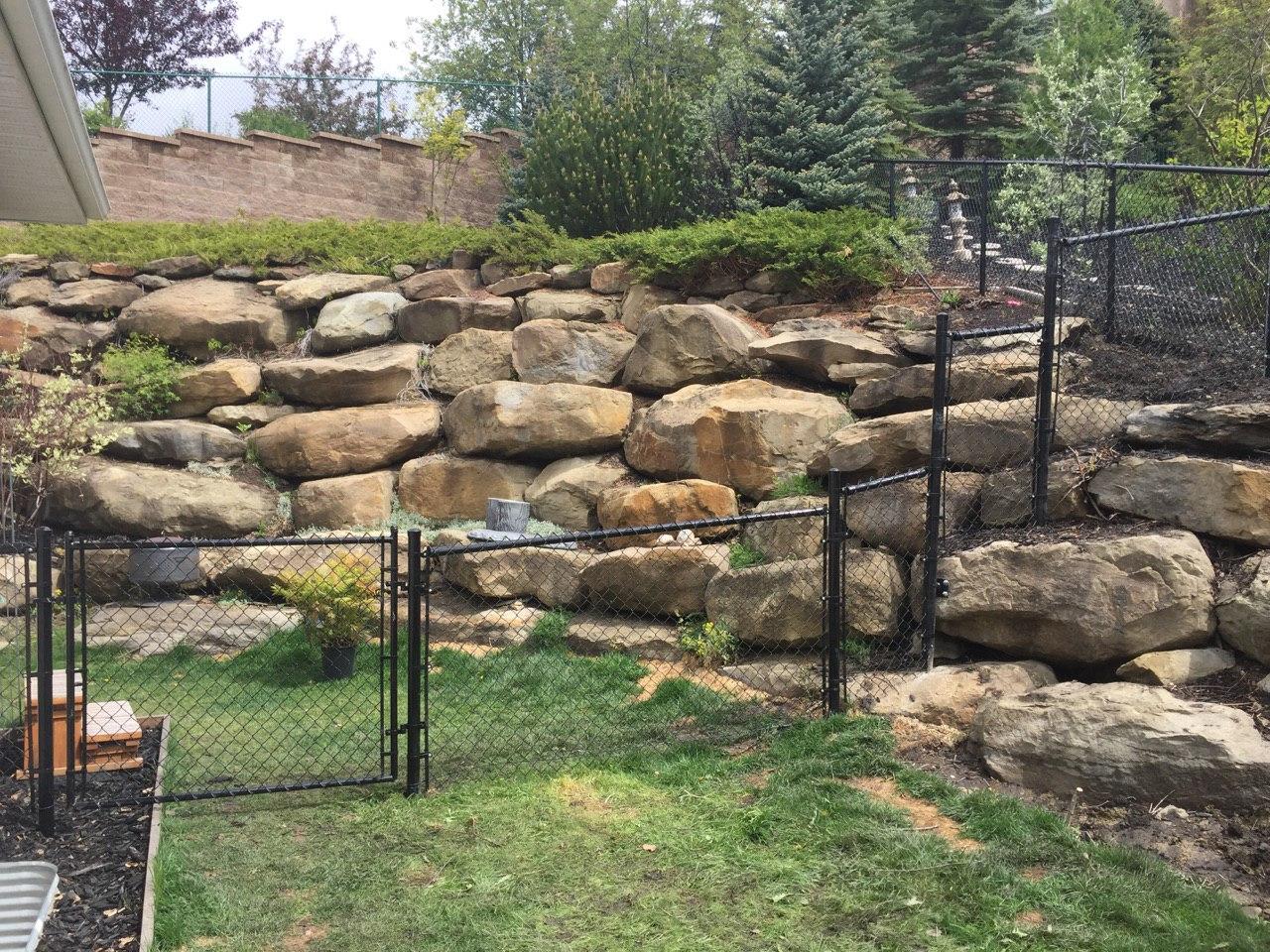 Black Chain Link Fence Installed on Slope